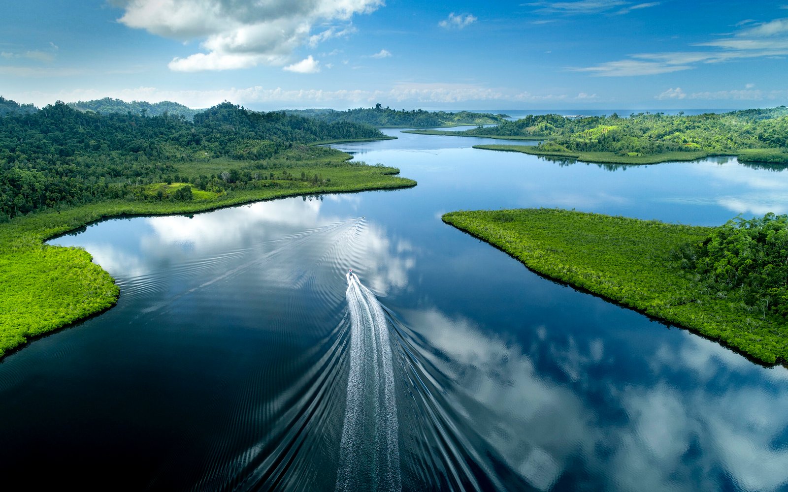 crossing the kabalutan straits in Togean Islands tour package