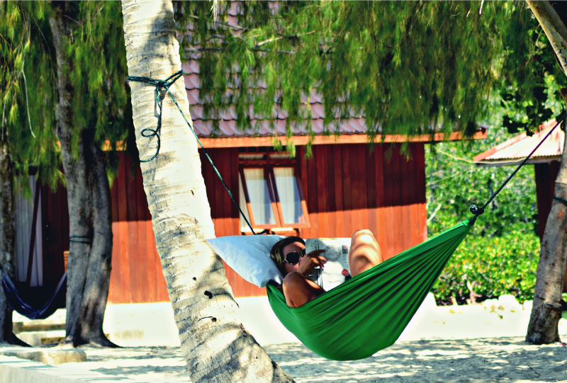 enjoy reading in the hammock while relaxing during togean island retreat trip